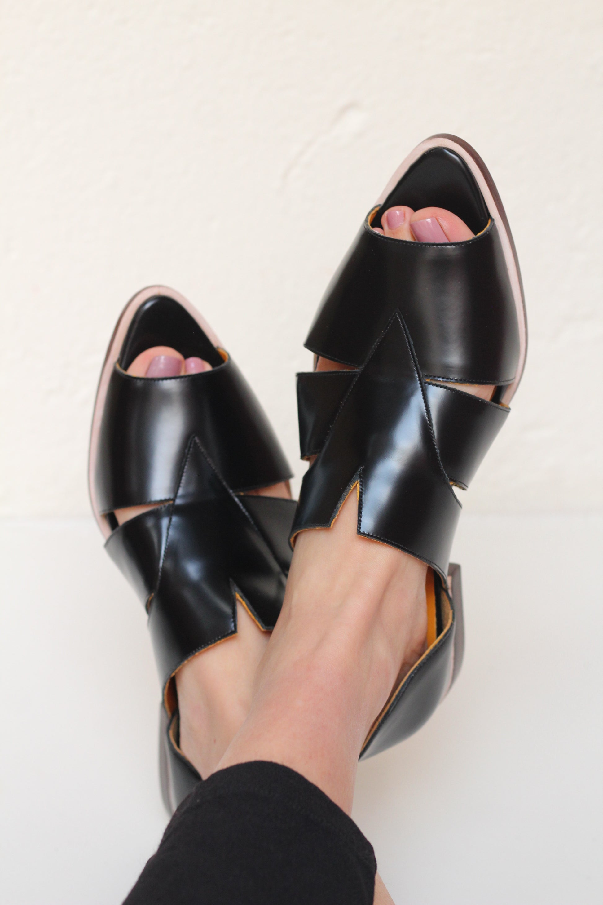 Agatha Black Peep-toe Sandals by Mafalda Handmade worn by model showing pointy toes