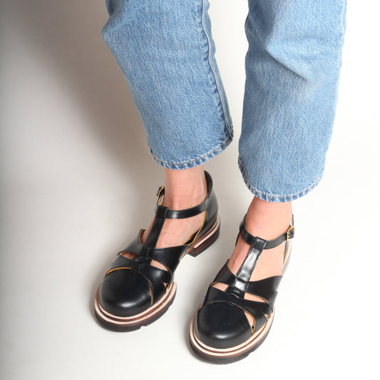 Maite Black Fisherman Sandals by Mafalda Handmade model wearing with blue jeans