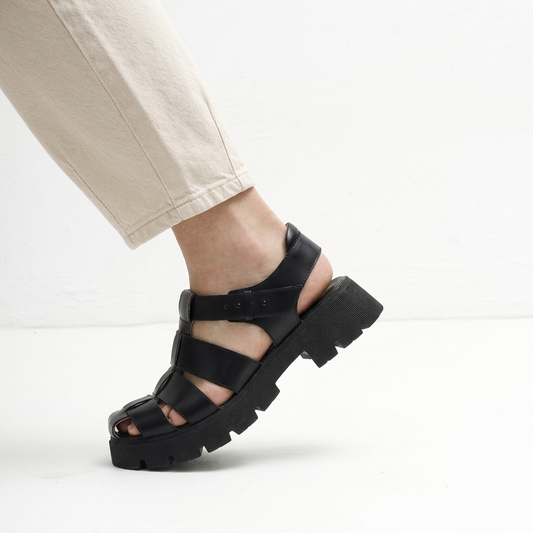 Aurora Black Chunky Sandals by Mafalda Handmade worn by model with beige jeans