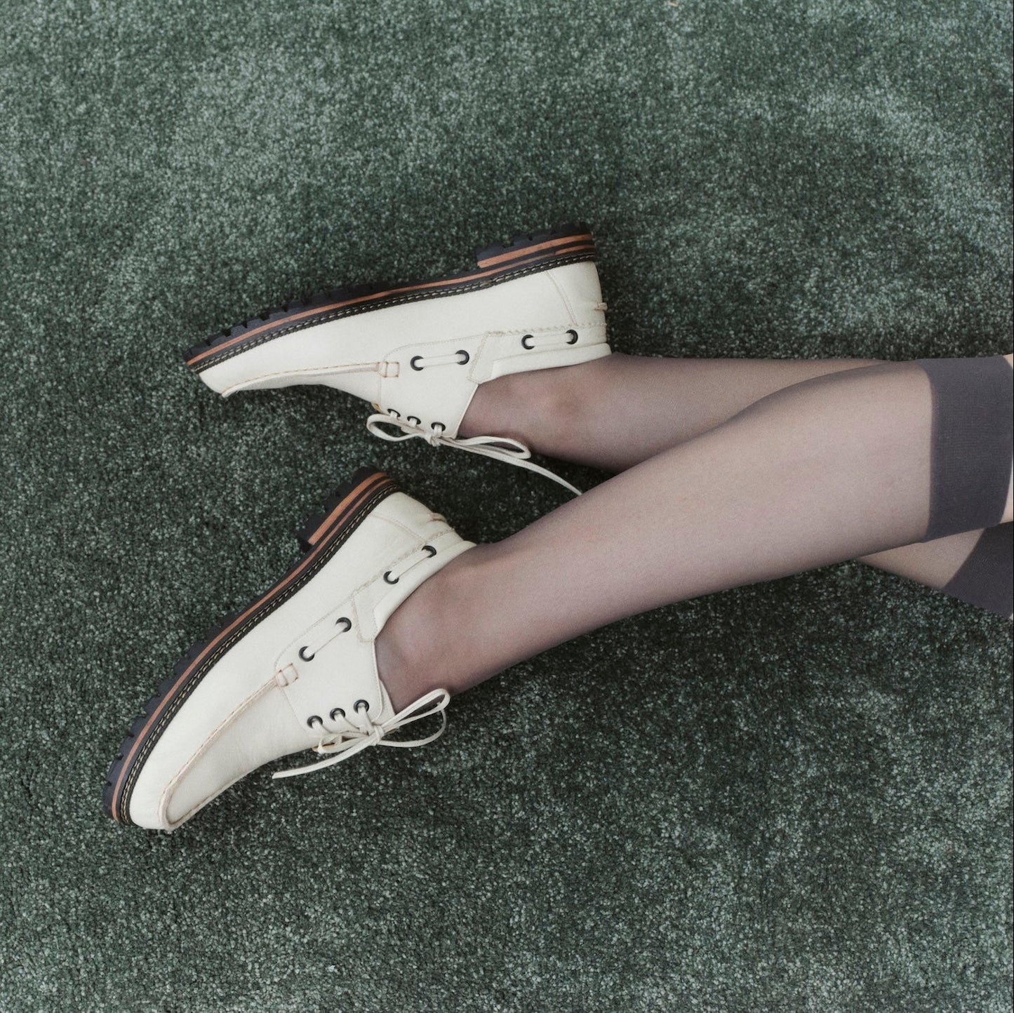 Donatela Off-White Boat Shoes by Mafalda Handmade on model with grey 7/8 tights