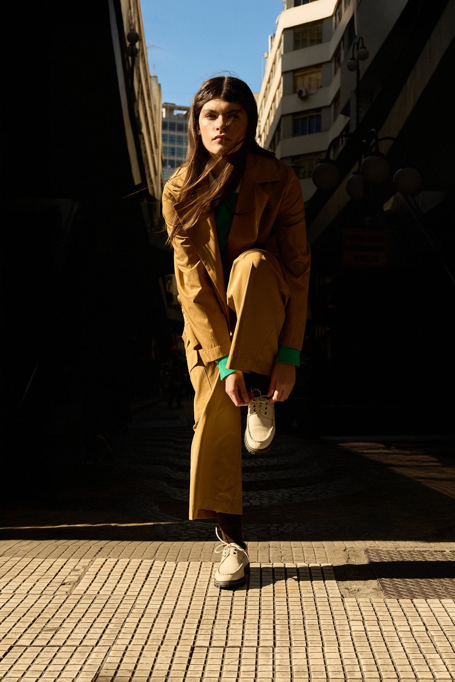 Donatela Off-White Boat Shoes by Mafalda Handmade worn by model with an ochre suit and green t shirt