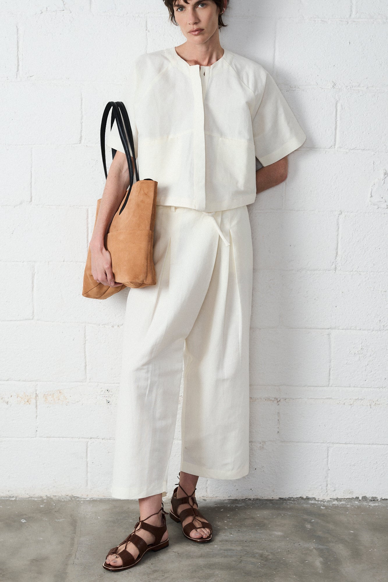 Person wearing a white outfit with
Magali Brown Lace Up Sandals By Mafalda Handmade